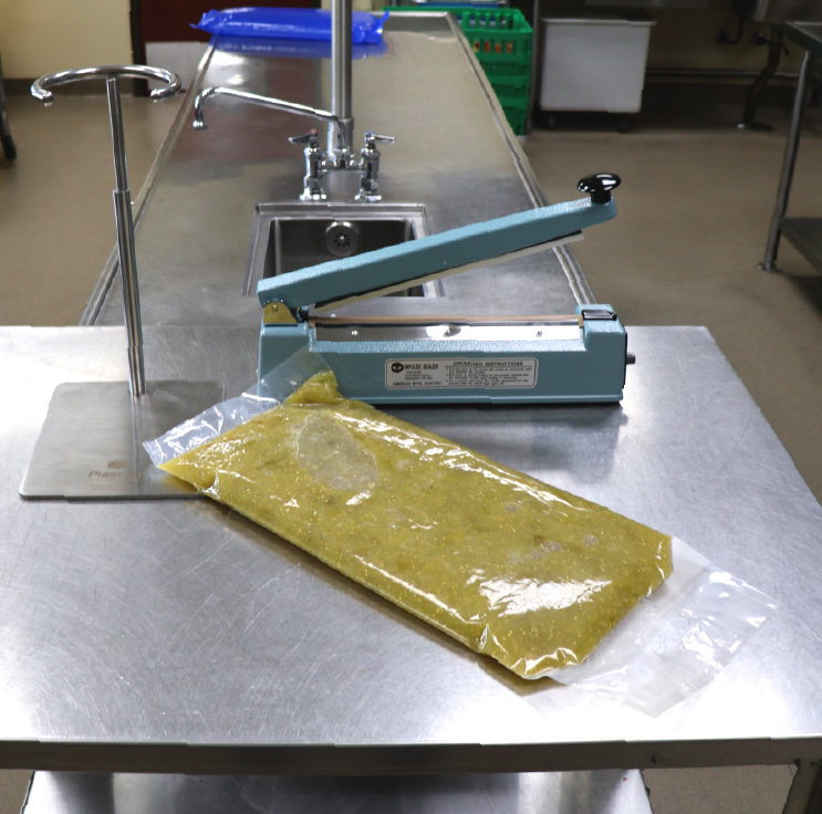 Filled Cook Chill bag and accessories in a prep kitchen